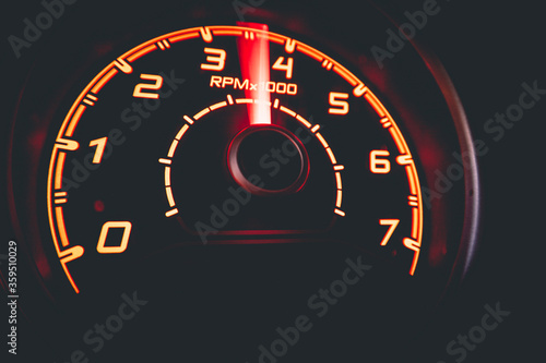 Driver's cockpit ; speedometer on dashboard - colorful light in black, copy space for your abstract design	