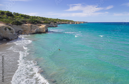 The most beautiful coast of Apulia: Torre Sant' Andrea, Otranto , ITALY (Lecce).Typical coastline of Salento: view of Punticeddha beach. Seascape with cliffs, rocky arch and sea stacks.