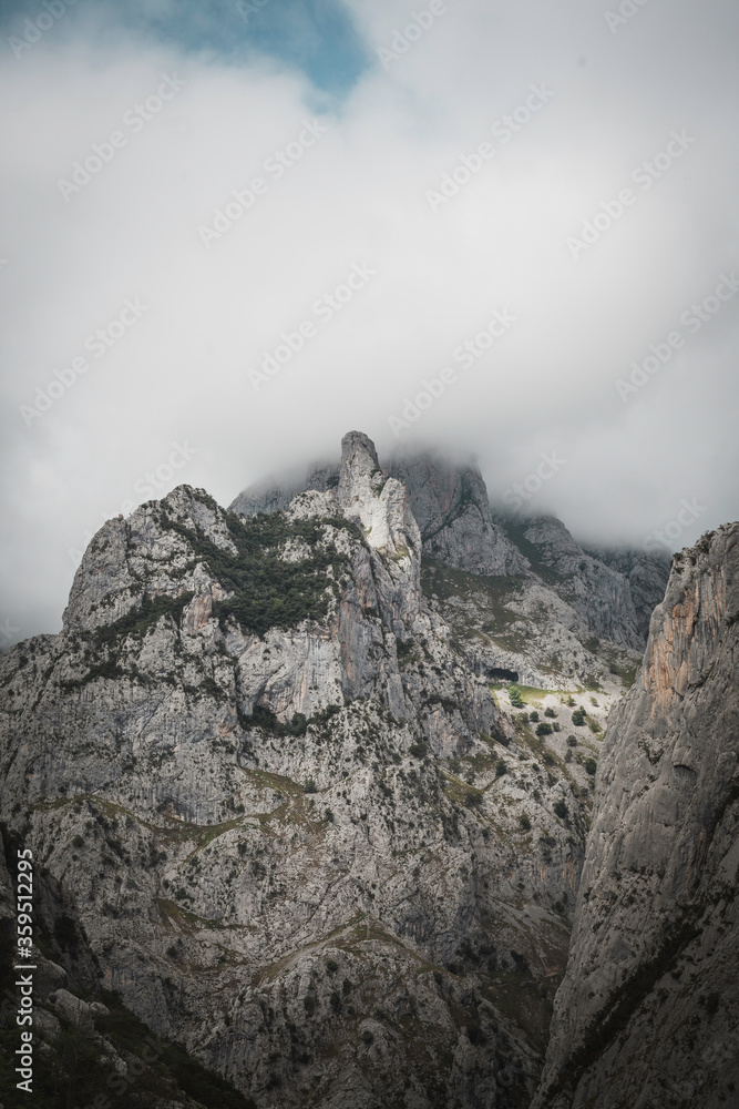Cloudy day in Picos de Europa, mountains touched by the sun, Asturias, beautiful scenery of the North Spain, national park
