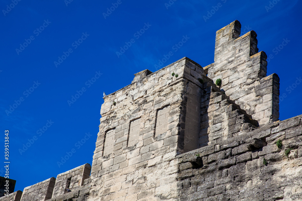 Medieval built Avignon city stone wall at French Provence