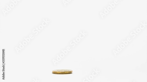 Four piles of gold money coins decreasing fading disappear one by one at white isolated background, financial trading concept
