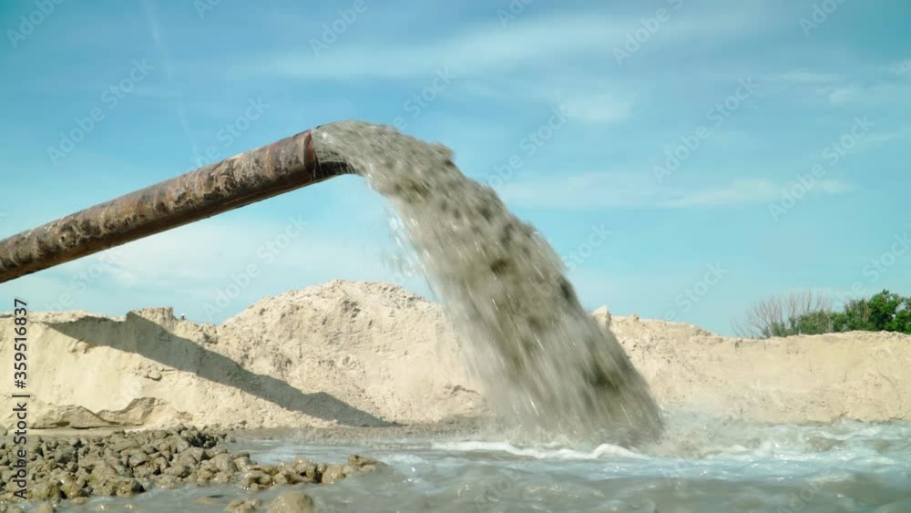 Wastewater from Large Rust Pipe Merge into Environment on the background of the Forest. Sewage from the Sewer Pollutes Terrain. Environmental Pollution. Ecological Catastrophy Wastewater from Large Rust Pipe Merge into Environment on the background of the Forest. Sewage from the Sewer Pollutes Terrain. Environmental Pollution. Ecological Catastrophy