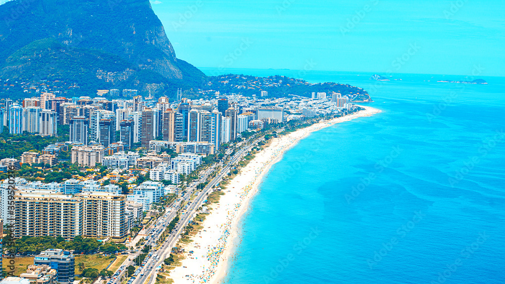 Fototapeta premium Rio's Best Beaches with turquoise water: famous Copacabana Beach, Ipanema Beach, Barra da Tijuca Beach in Rio de Janeiro, Brazil. Aerial view of Rio de Janeiro from helicopter. Top view, horizontal