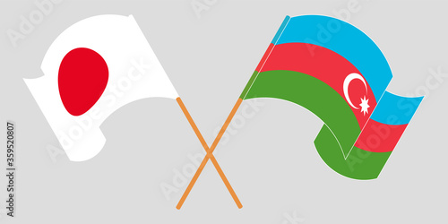 Crossed and waving flags of Azerbaijan and Japan
