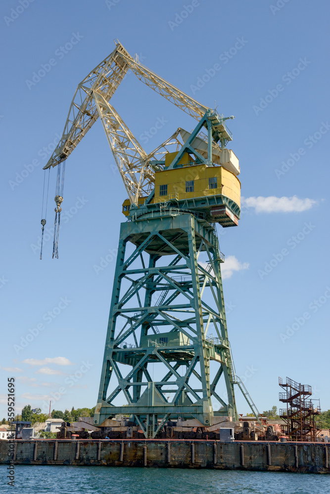 Powerful crane is in Southern Bay seaport, Sevastopol, Crimea, Russia.