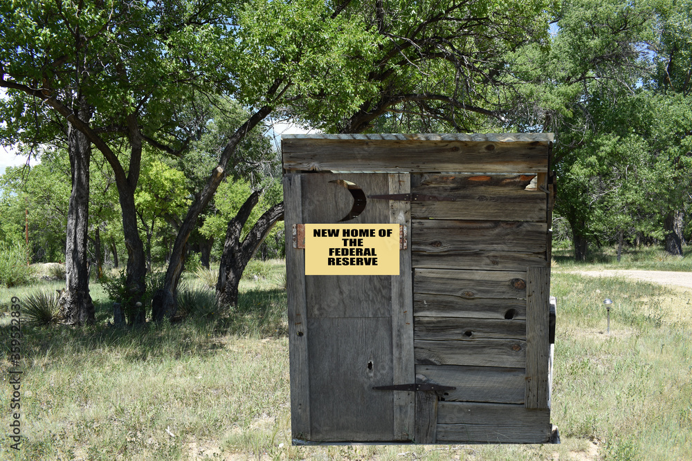Isolated close up of a new home of the Federal Reserve sign attached to an outhouse Isolated close up of a new home of the Federal Reserve sign attached to an outhouse