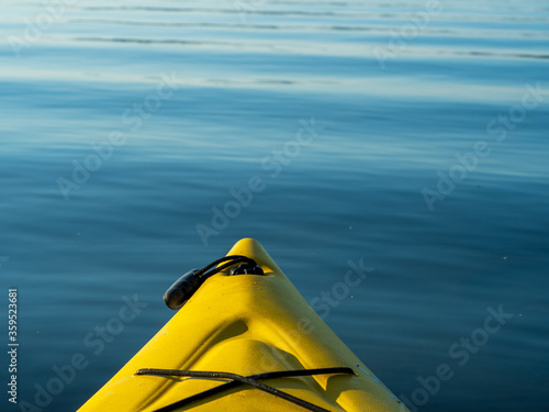 bow of yellow kayak on water © Jim Babbage