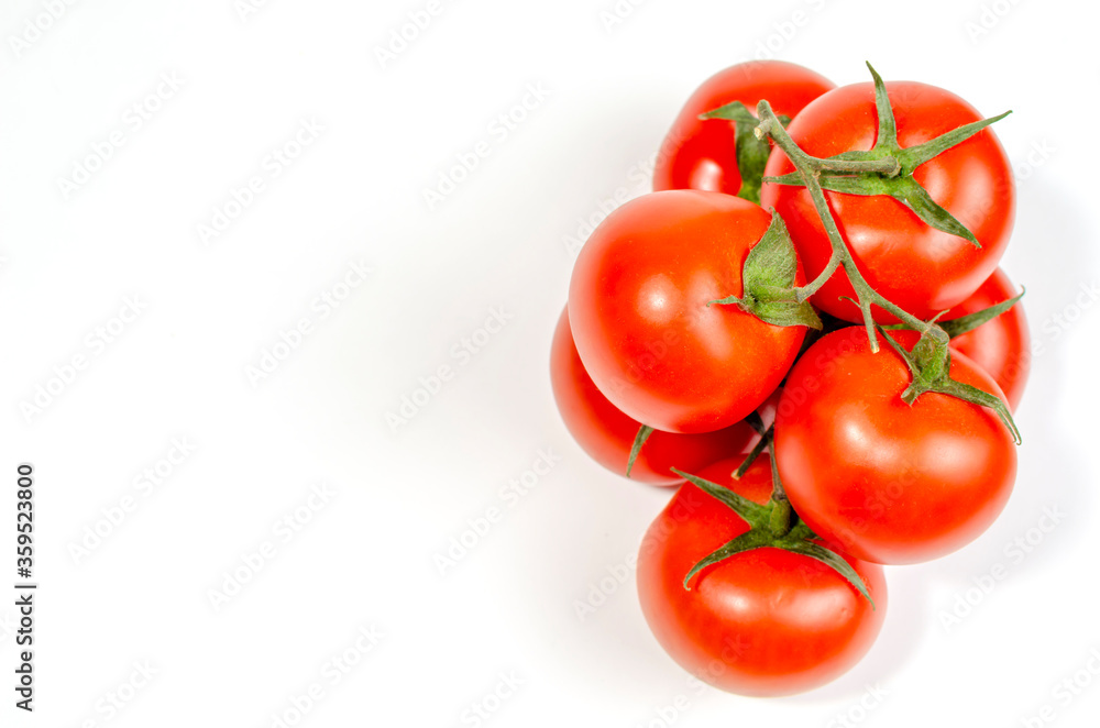 a sprig of red tomatoes is isolated on a white background a sprig of red tomatoes is isolated on a white background