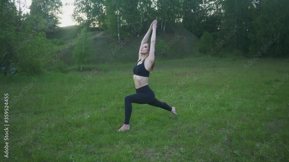Young woman doing yoga in park. Body positive, outdoor sports Young woman doing yoga in park. Body positive, outdoor sports