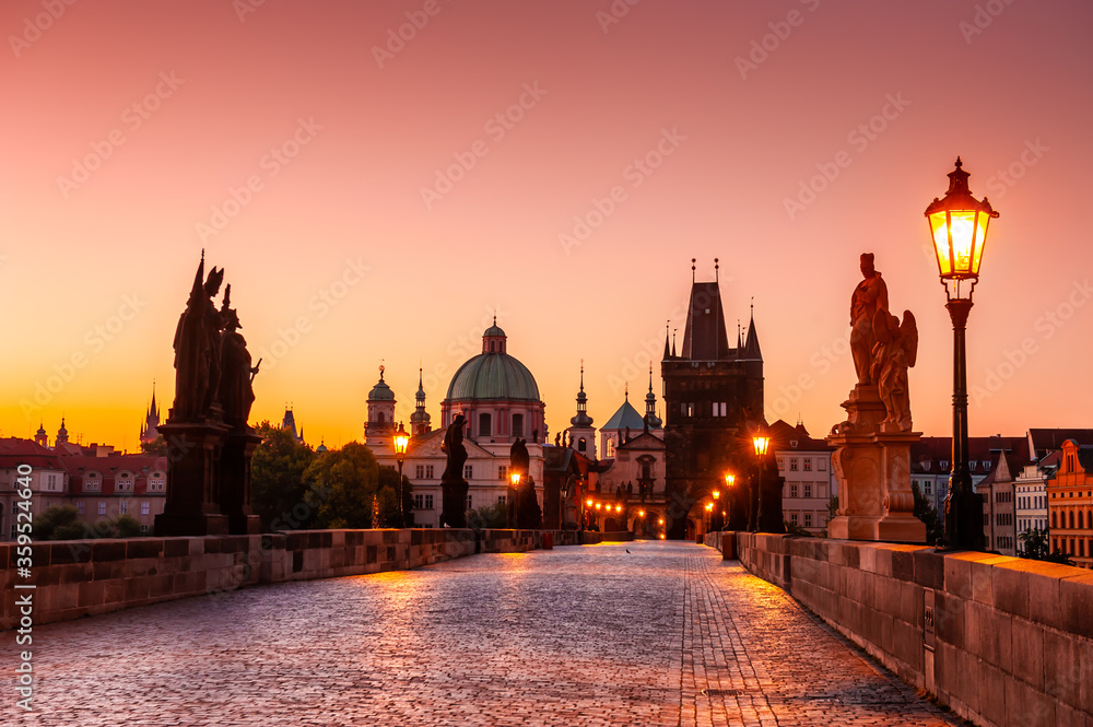 Charles Bridge and Old Town at sunrise in Prague, Czech Republic. Famous travel destination