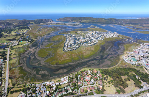 Knysna, Western Cape / South Africa - 02/05/2019: Aerial photo of Thesen Island with Knysna Heads in the background