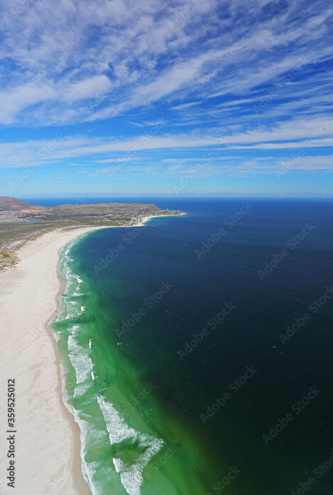 Cape Town, Western Cape / South Africa - 03/28/2018: Aerial photo of Noordhoek Beach with Kommetjie in the background