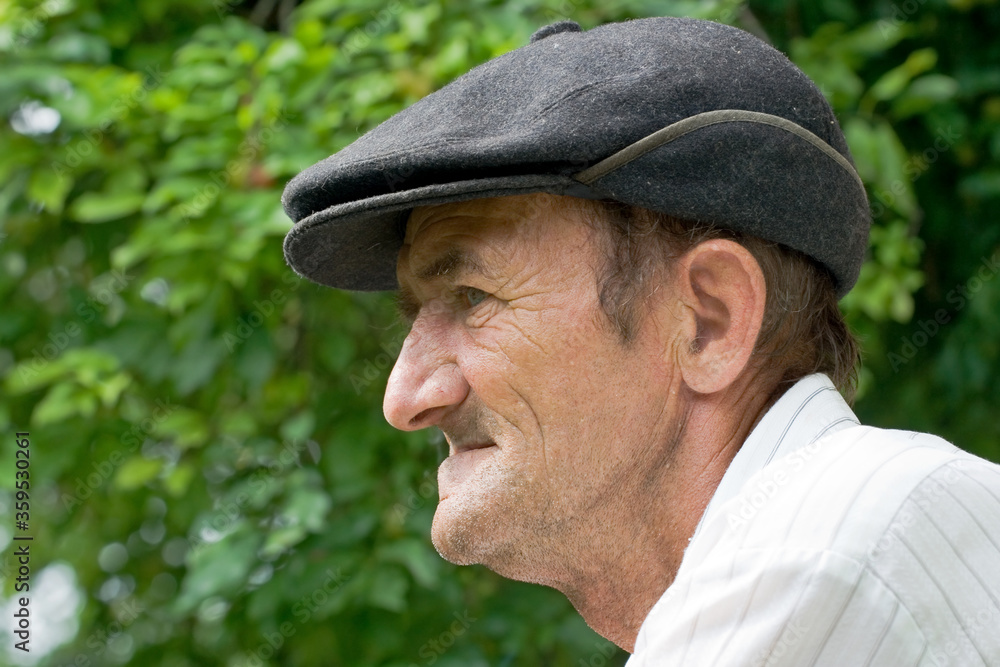 outdoors portrait of a poor old man with no teeth