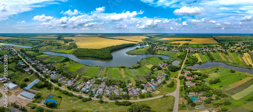 the village of Aleksey-Tenginskaya near the Sredny Zelenchuk River, in the Krasnodar Territory, southern Russia. Aerial panorama  on a summer day