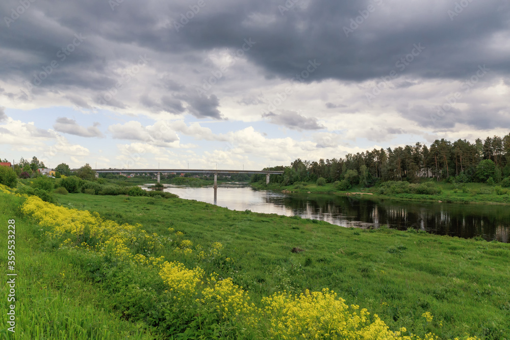 Beautiful summer day by the river, thunderclouds, Kraslava, Latgale, Latvia Beautiful summer day by the river, thunderclouds, Kraslava, Latgale, Latvia