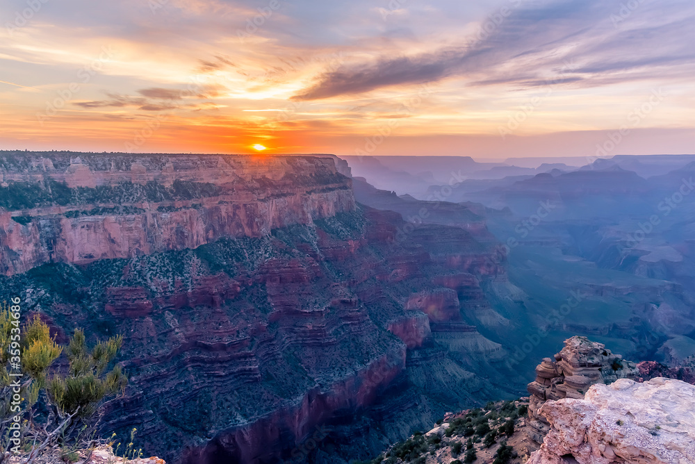The sunset highlights multi-colored rock strata viewed from Yaki Point on the South Rim of the Grand Canyon, Arizona