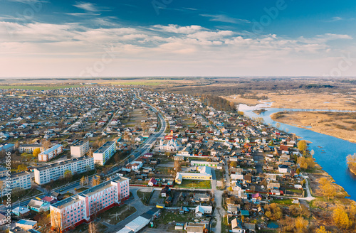 Dobrush, Gomel Region, Belarus. Aerial View Of Dobrush Cityscape Skyline In Spring Evening. Residential District And River In Bird's-eye View