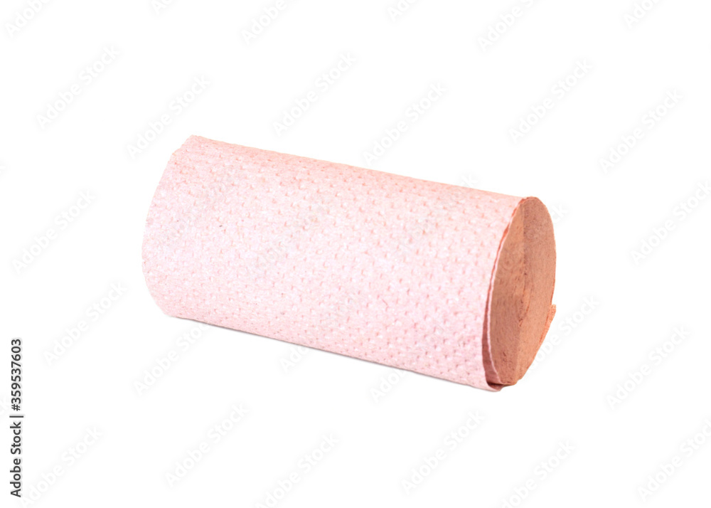 Thin roll of gray toilet paper made from recycled paper on white background Thin roll of gray toilet paper made from recycled paper on white background