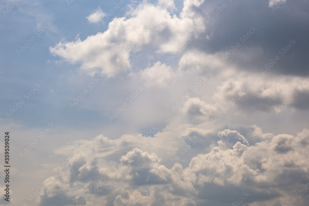 Blue sky background with big white tiny stratus cirrus striped clouds Blue sky background with big white tiny stratus cirrus striped clouds