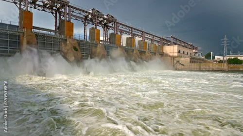 Discharge water from the dam of hydroelectric plant photo