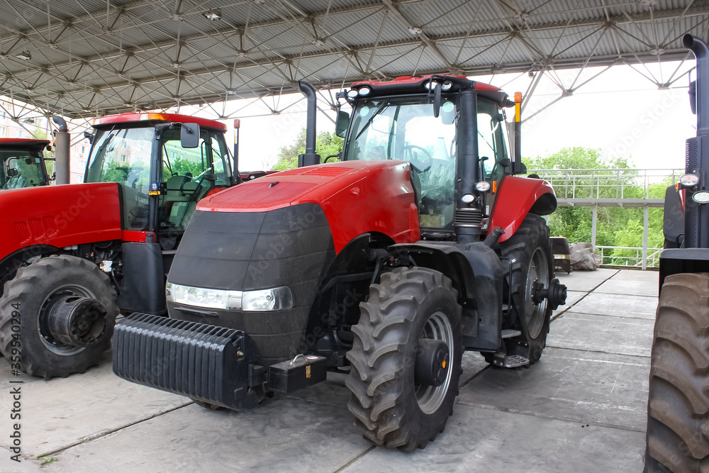 Obraz premium The colorful tractors in the road