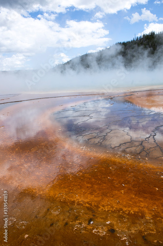 Steam rises from Grand Prismatic Pool.