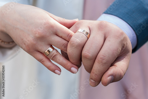  Wedding rings on a light background with place for text.