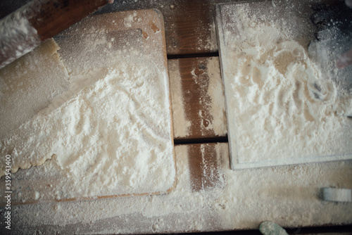 Top view of rustic wooden table covered with flour. photo