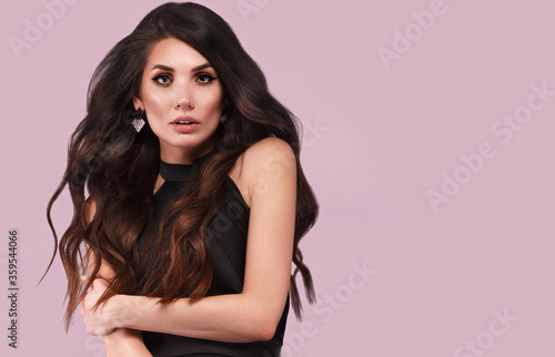 Wallpaper Mural Beautiful brunette woman with curls and classic make-up in a black dress. Beauty face. Torontodigital.ca