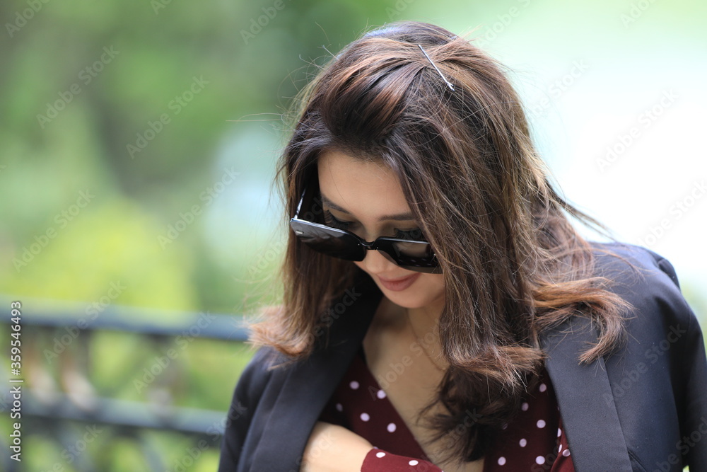 close up portrait of a beautiful asian girl in black sunglasses close up portrait of a beautiful asian girl in black sunglasses