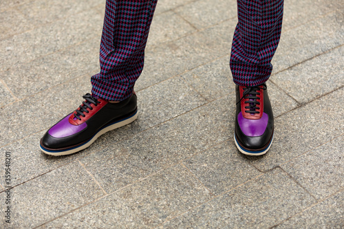 view of a pair of purple sneakers shoes