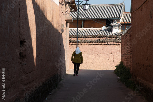  View of narrow street in rural traditional Chinese village. Typical street scene in Chinese villages photo