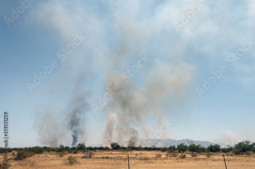 Beginning of Arizona USA arson wildfire in the rural desert threatening to endanger community