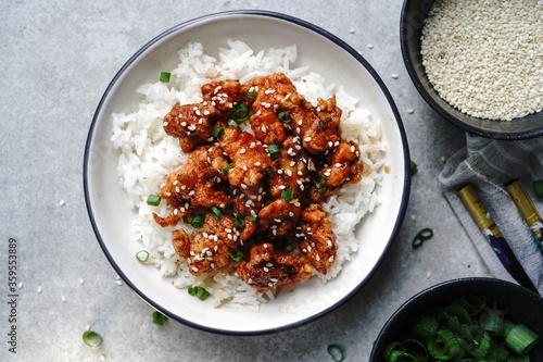 Homemade sesame Chicken served with Jasmine white rice, selective focus