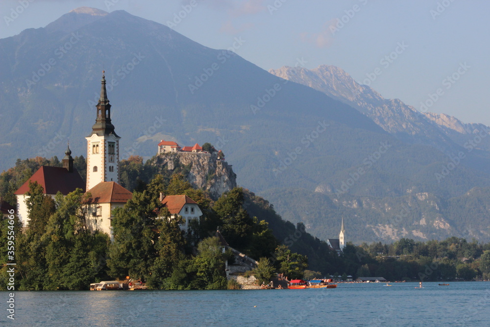 Sunny morning at Lake Bled and Julian Alps in the background