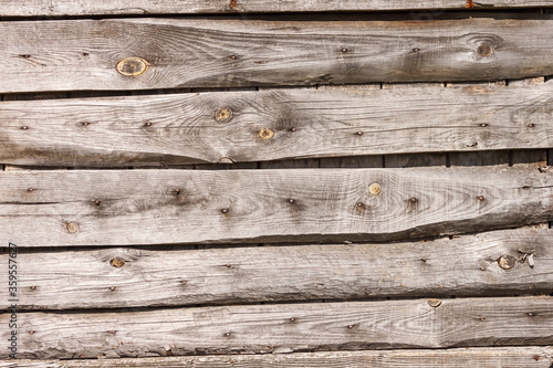 Wooden background. The wall of old wooden boards. Old grunge wooden wall. Close-up, 