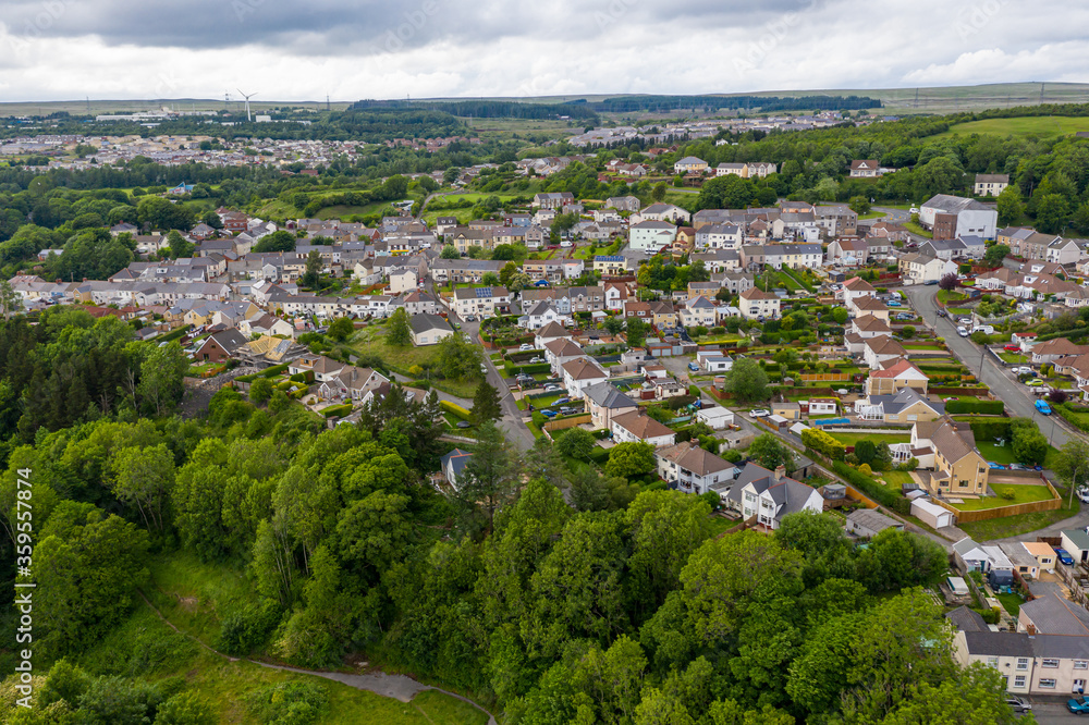 Aerial drone view of a residential area of a small Welsh town surrounded by hills (Ebbw Vale, South Wales, UK)