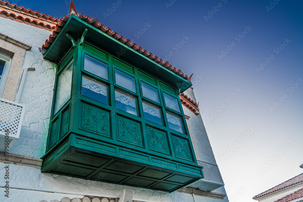 old house with green balcony
