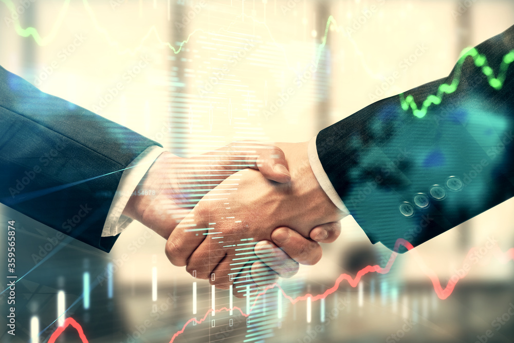 Double exposure of forex graph hologram and handshake of two men. Stock market concept.