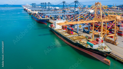 Aerial view container cargo ship, import export commerce global business trade logistic and transportation of International by container cargo ship boat, Freight shipping maritime sea port terminal.