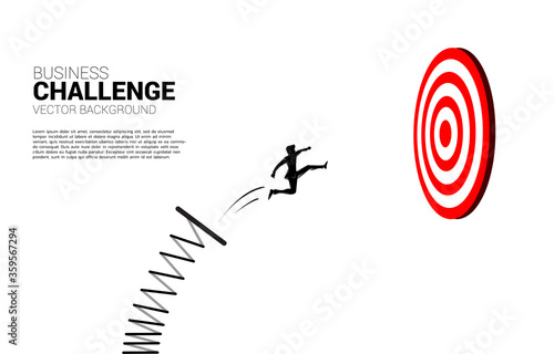 silhouette of businessman jumping to target dartboard. Business Concept of targeting and customer.route to success.
