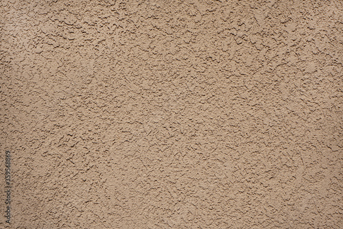 A Stucco Wall Texture light beige background