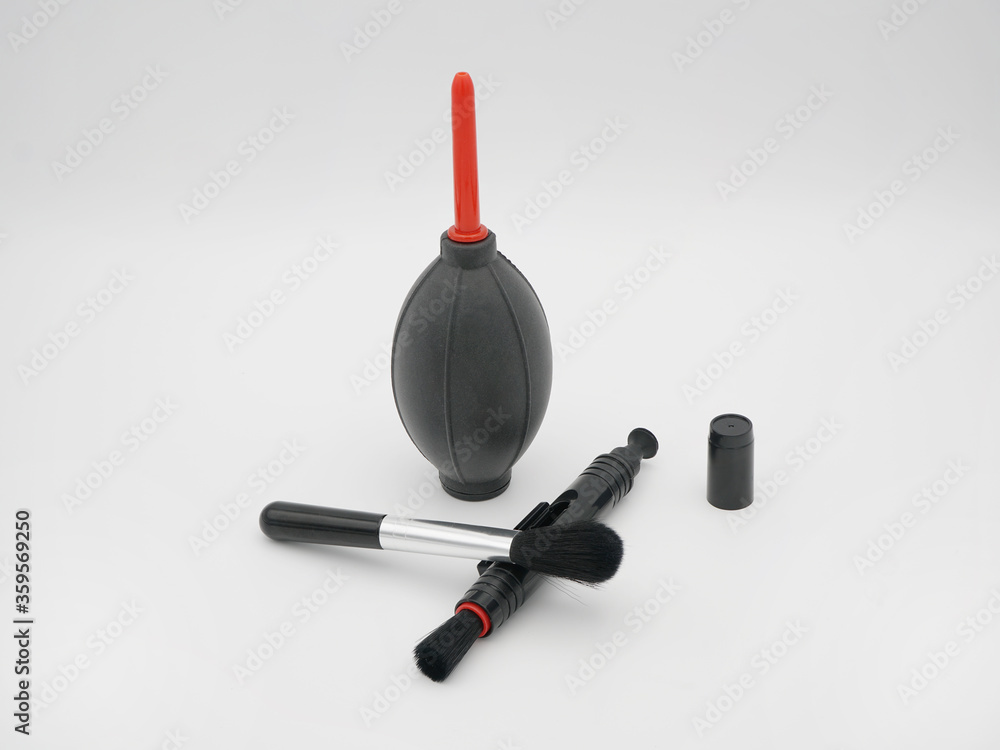 Camera cleaning set: air blower, brush and lens cleaning pen. Camera cleaning set: air blower, brush and lens cleaning pen.