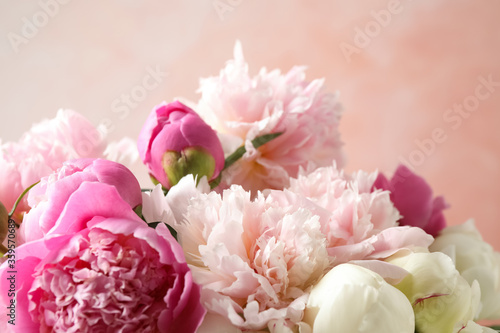 Beautiful peony bouquet on pink background  closeup