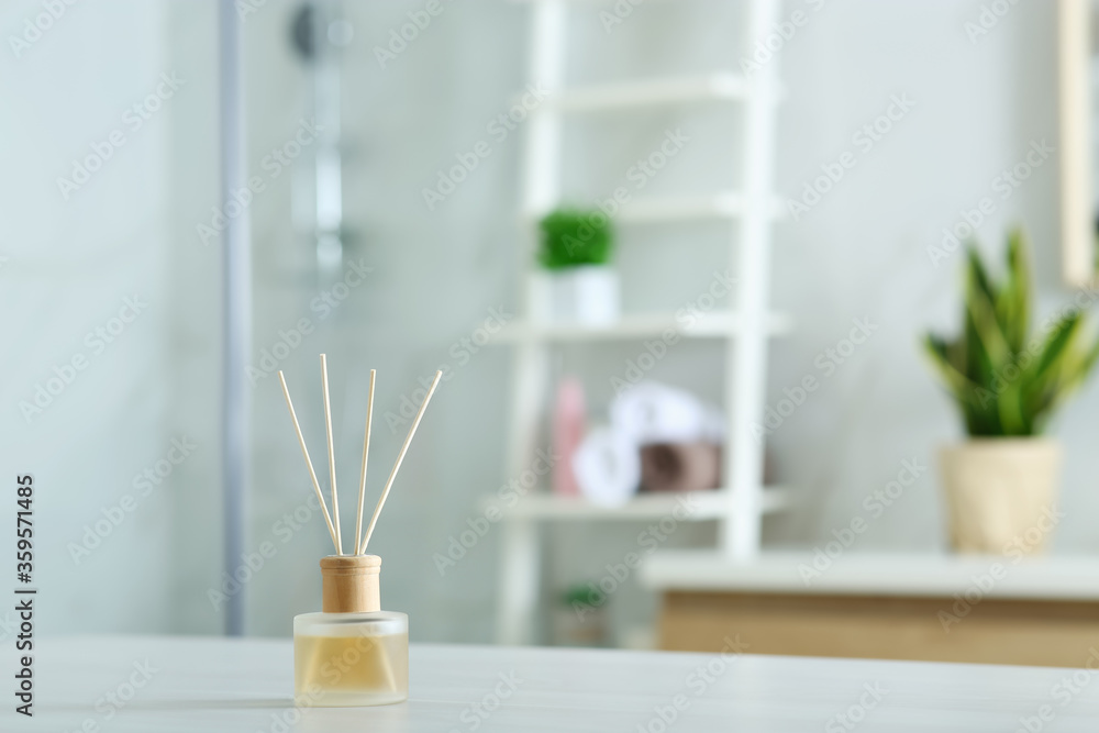 Aromatic reed air freshener on table indoors. Space for text Aromatic reed air freshener on table indoors. Space for text