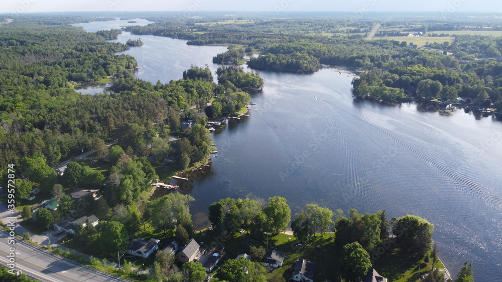 Aerial View of Beautiful Canadian Outdoor Landscape in Kawartha Lakes, Ontario during Clear Summer Weather Aerial View of Beautiful Canadian Outdoor Landscape in Kawartha Lakes, Ontario during Clear Summer Weather