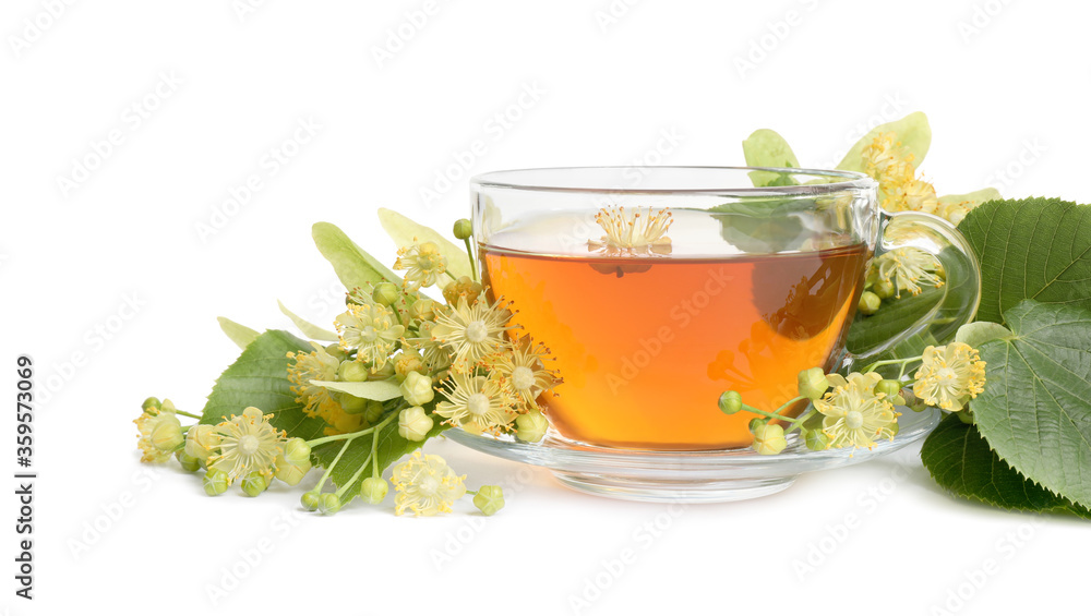 Cup of tea, linden leaves and blossom on white background Cup of tea, linden leaves and blossom on white background
