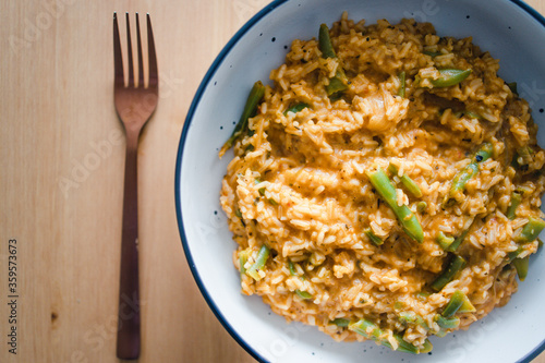 plant-based food, vegan red pesto risotto with green beans