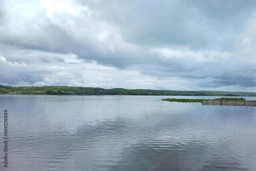 Panoramic view of Peten Itza lake on cloudy day in Guatemala Panoramic view of Peten Itza lake on cloudy day in Guatemala