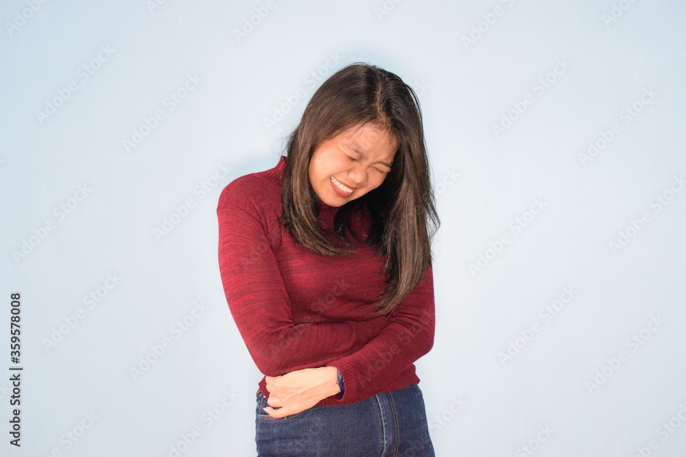 Portrait of Indonesian Woman Wearing Red Shirt And Posing With Isolated Background Portrait of Indonesian Woman Wearing Red Shirt And Posing With Isolated Background